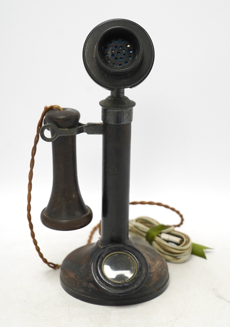 An early 20th century candlestick telephone, 31cm. Condition - fair